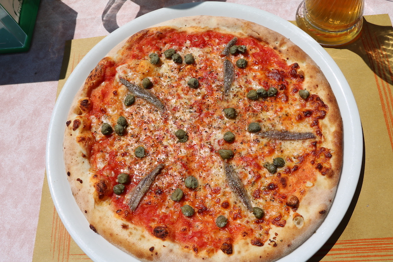 Pizza with capers and anchovies called Pizza Napoli