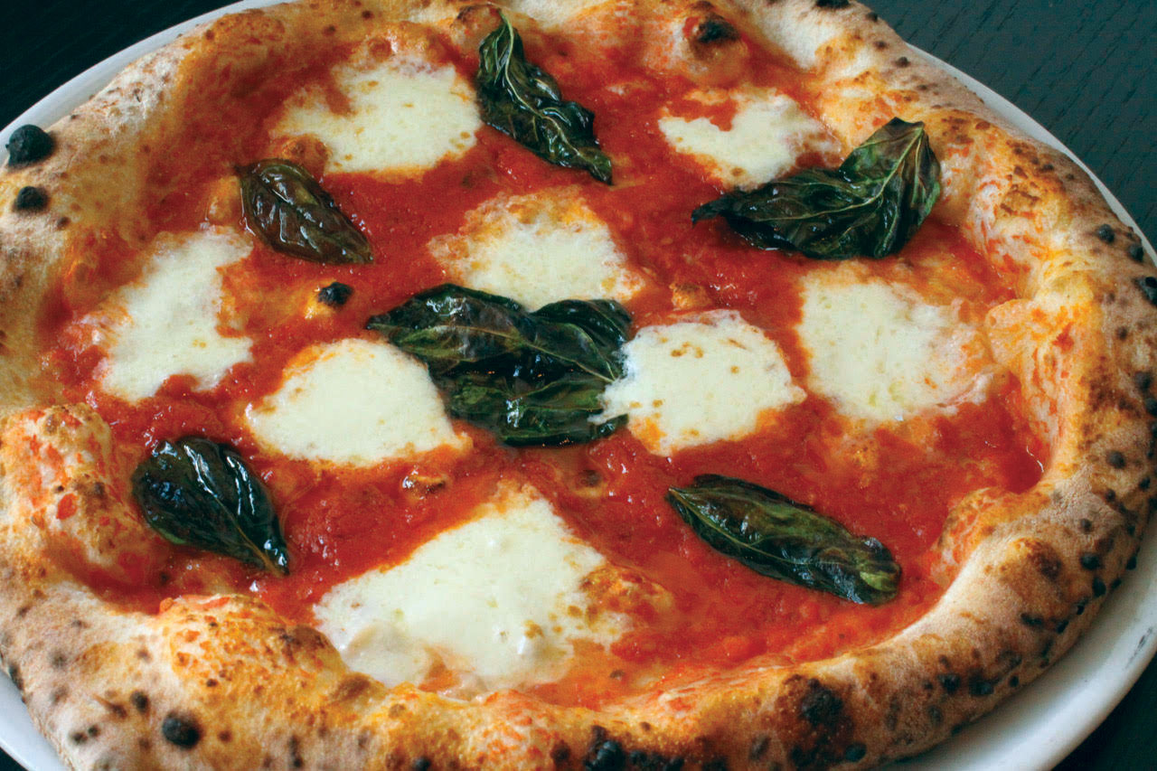 this photo shows that you can get delicious pizza at deaf-owned pizzeria Mozzeria