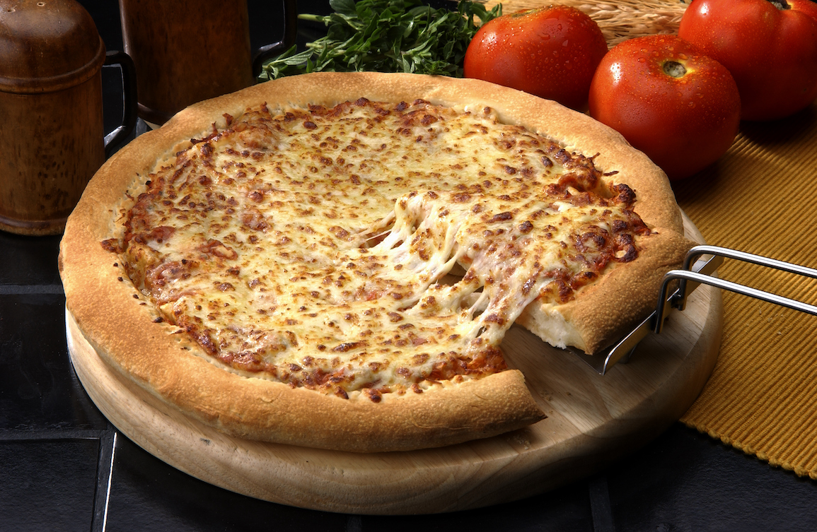 This photo shows a thick-crust Margherita pizza that's heavy on the melted cheese.