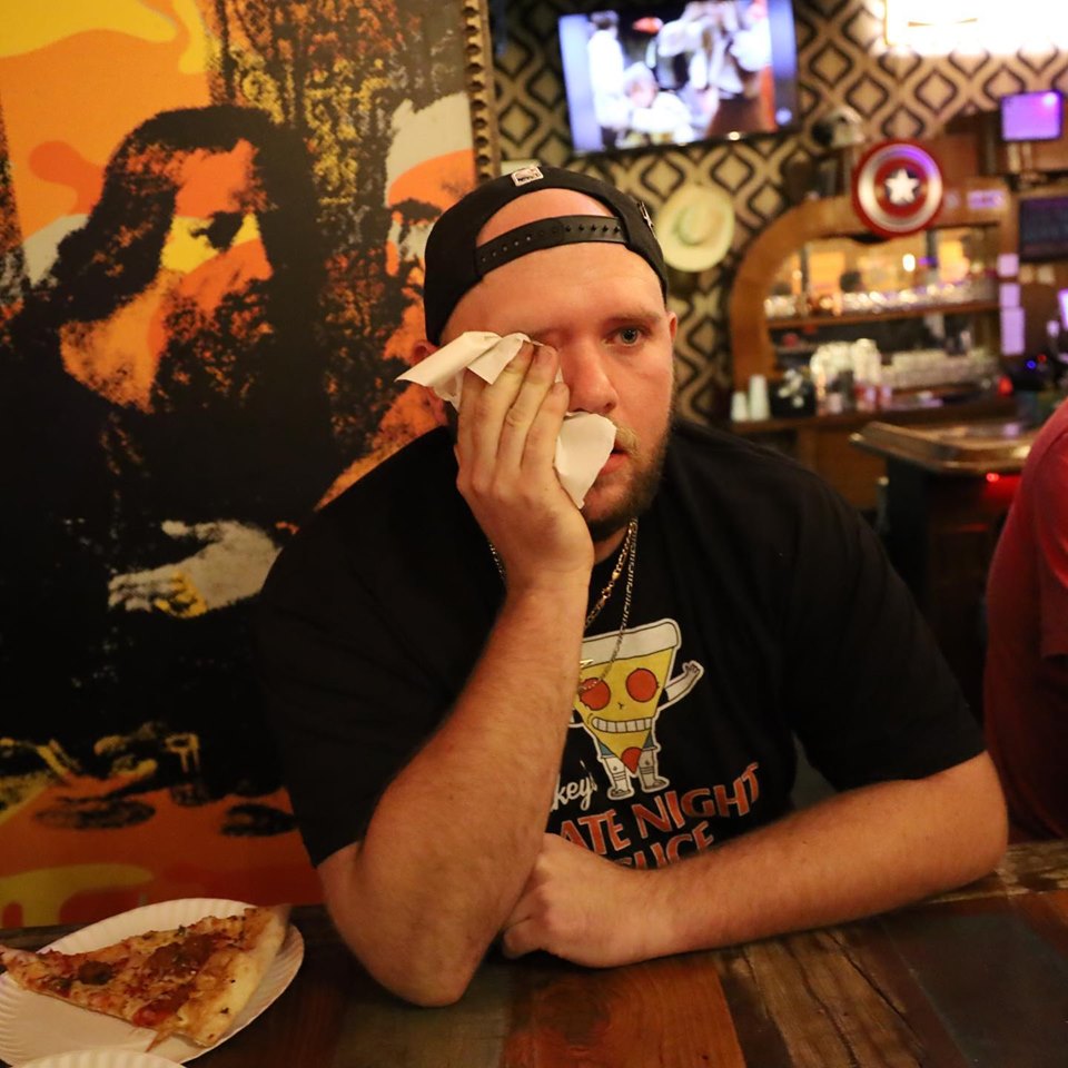 this photo illustrates the challenge of eating the world's hottest pizza at Mikey's Late Night Slice