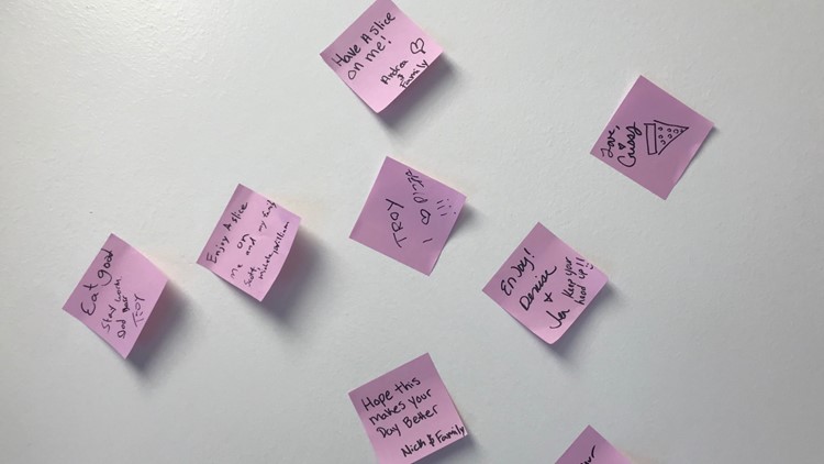 this photo shows the various post-it notes on the wall of Big Slice Pizzeria