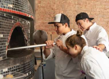 Harlem Pizza Co. owner Alper Uyanik and his two children