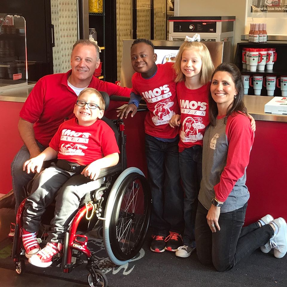 this photo shows staff at Imo's Pizza, home of the St. Louis pizza style