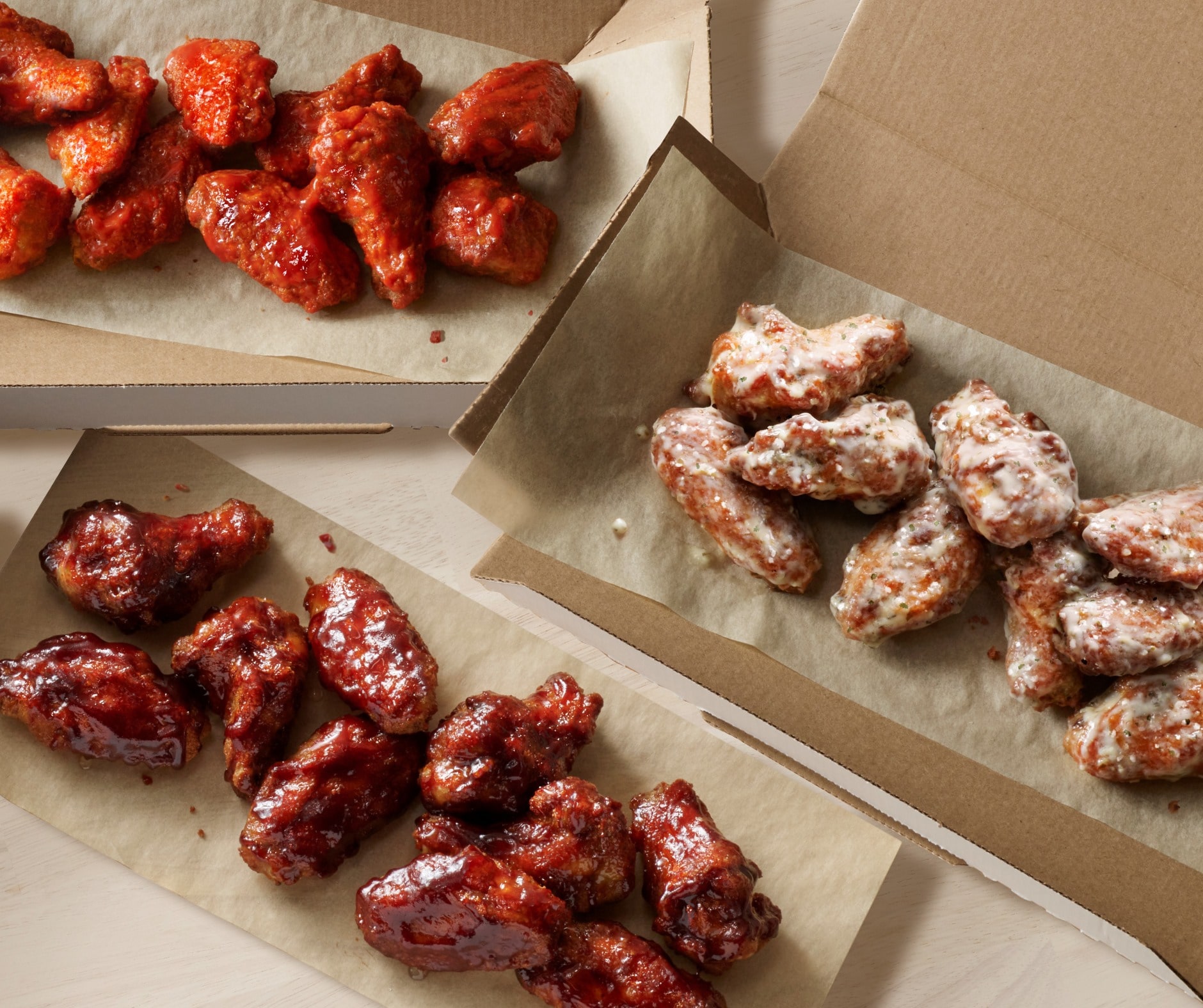 this photo shows several selections of new and improved chicken wings from Domino's