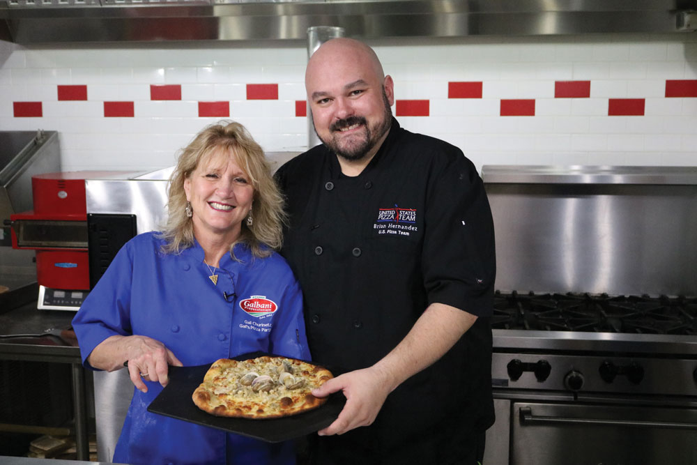 this photo shows Gail Churinetz of Gail's Pizza Parties with Brian Hernandez of PMQ