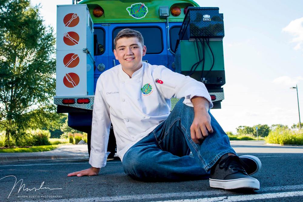 this photo shows childhood cancer survivor and pizza maker Lucas Hobbs of the Chef Lucas Food food truck.