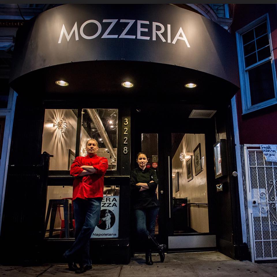 this photo shows Melody Stein and Russ Stein, owners of Mozzeria, a deaf-owned restaurant in San Francisco and Washington, D.C.