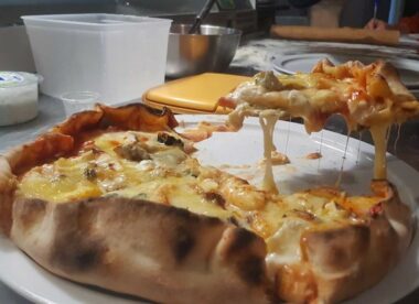 this is a photo of a pizza that set a Guinness World Record for most varieties of cheese on a pizza