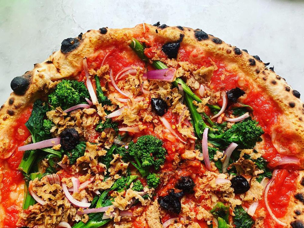 this photo shows a vegan pizza with products from VEDGEco, a national wholesaler of plant-based foods