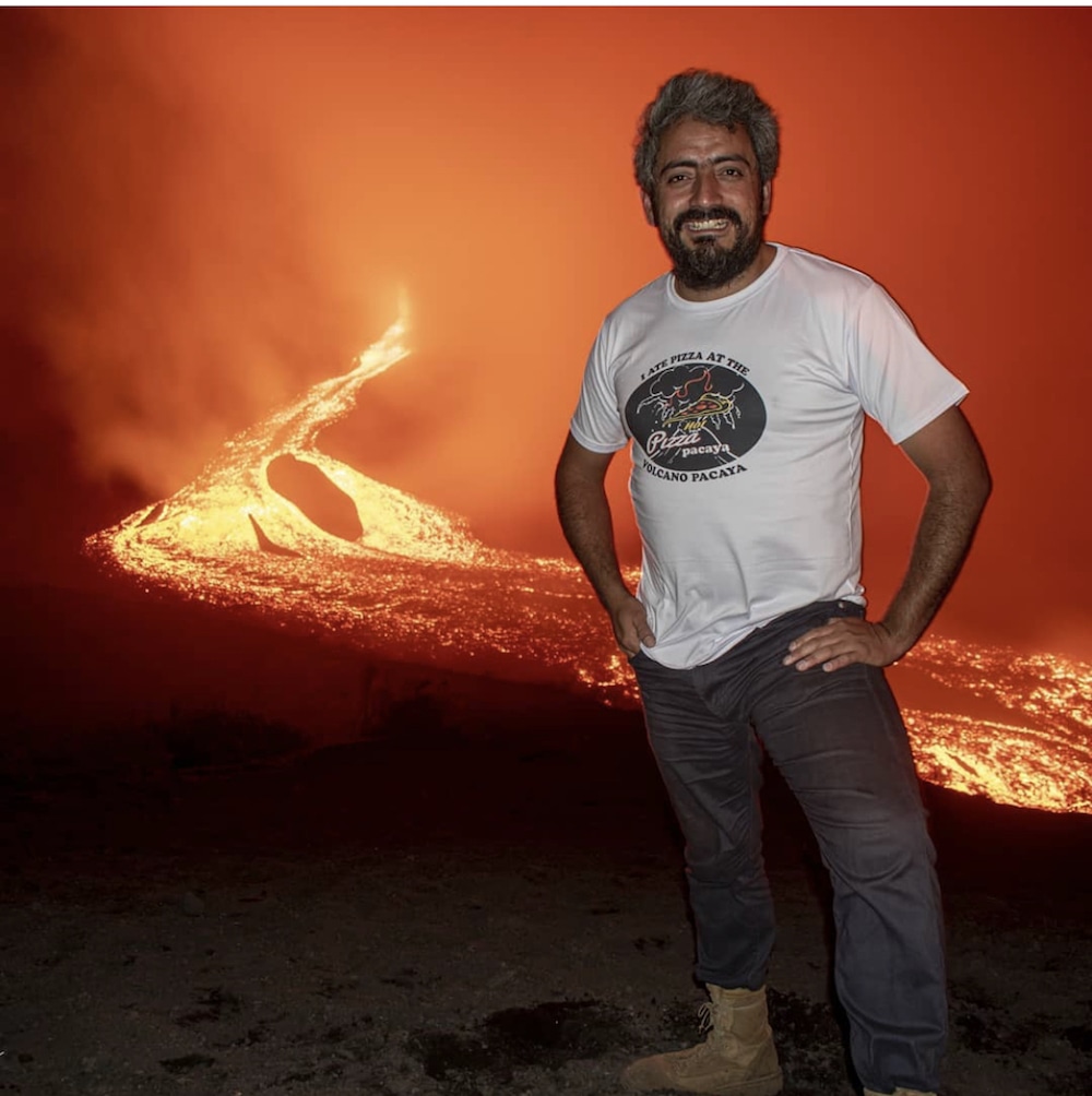 this photo shows David Garcia of Pizza Pacaya standing at a volcano where he makes his pizzas in Guatemala