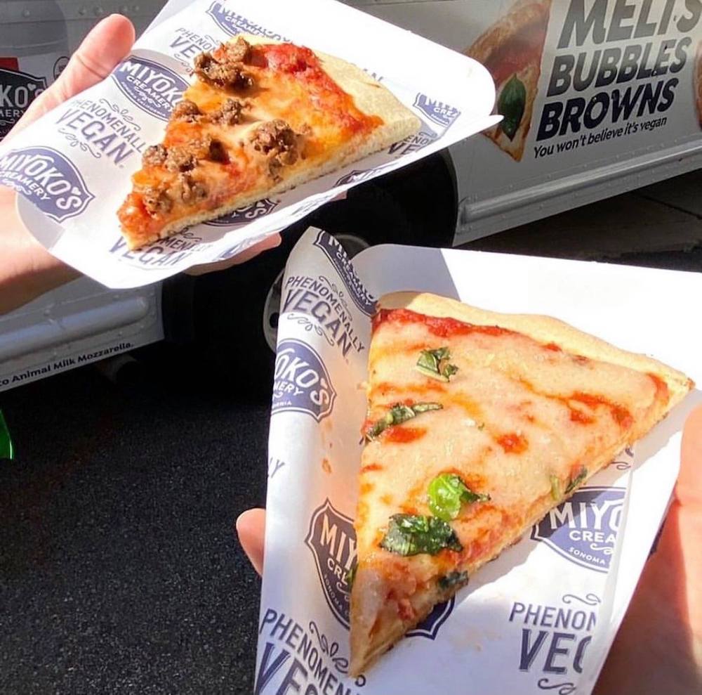 this photo shows two slices of pizza made with Miyoko Creamery's Liquid Vegan Pizza Mozzarella