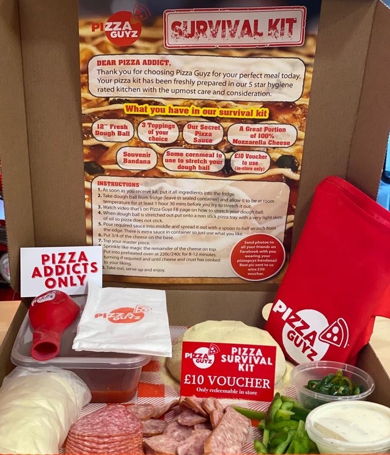 this photo shows Pizza Guyz' pizza kit, complete with a list of the ingredients as well as the ingredients themselves in a box, such as pepperoni, cheese, bell peppers, jalapeños, sauces and napkins