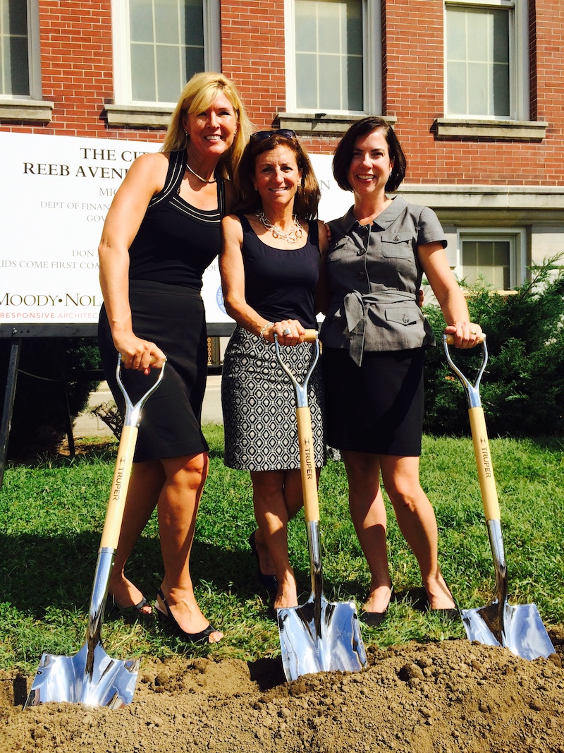 this photo shows Jane on the left with two other women, brandishing shovels at the groundbreaking ceremony for the Reeb Center