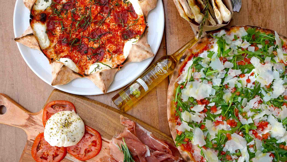 this photo shows one star-shaped pizza and one round pizza