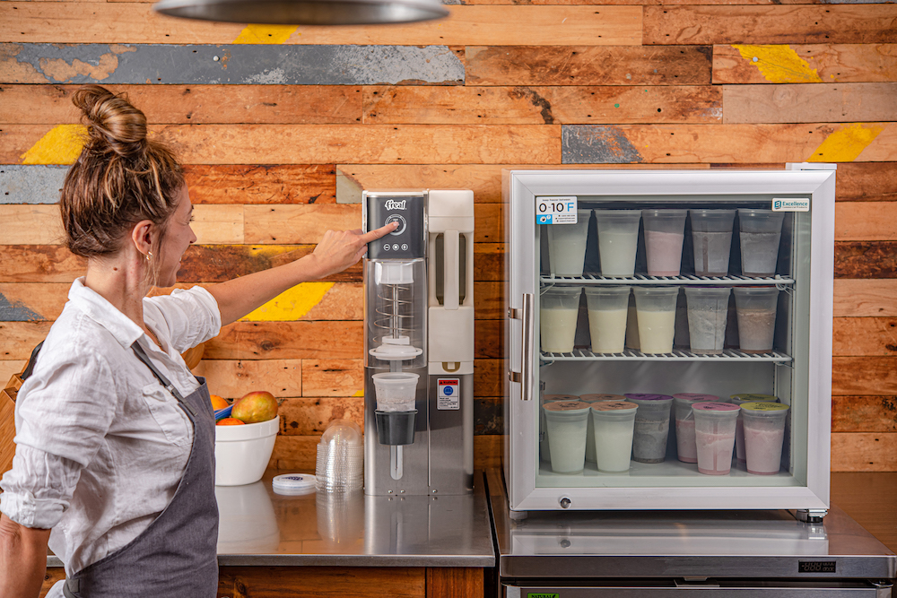 this photo shows a young woman operating the B7 Blender