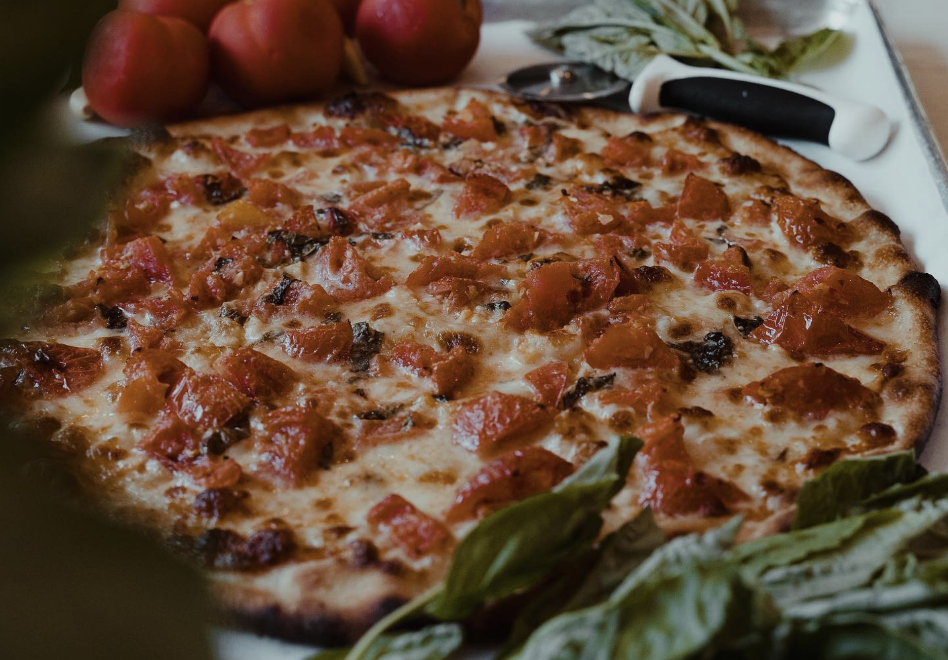 photo shows a fresh tomato pie from Frank Pepe's Pizzeria in New Haven, Connecticut.