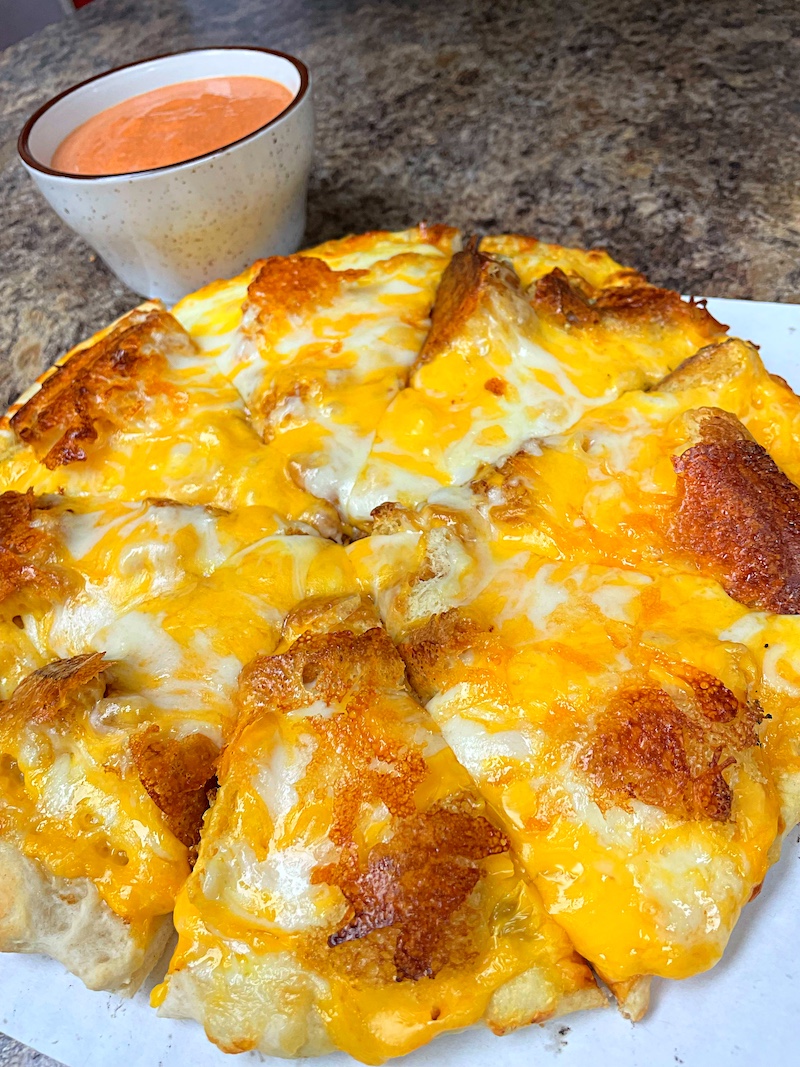 This photo shows a pizza version of a grilled cheese sandwich.