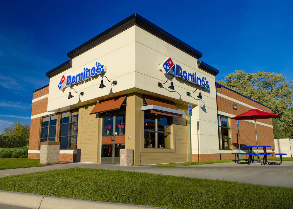 This photo shows the exterior of a Domino's Pizza store in Lansing, Michigan.