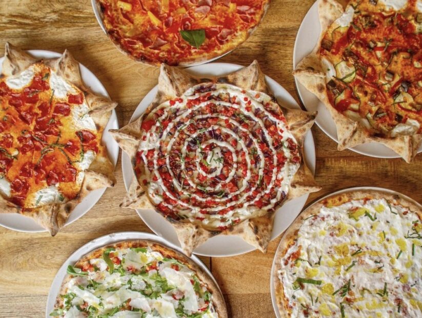 This photo shows an array of delicious-looking pizzas, some of them star-shaped, from Mister O1
