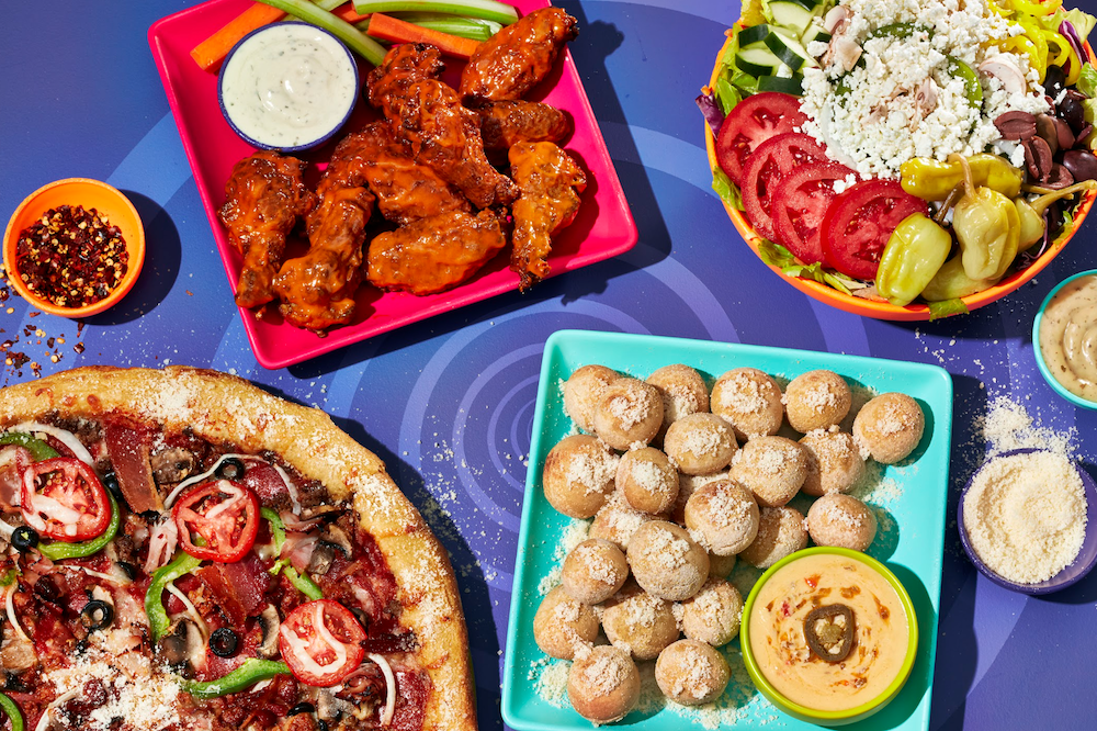 A table full of Mellow Mushroom food and appetizers.