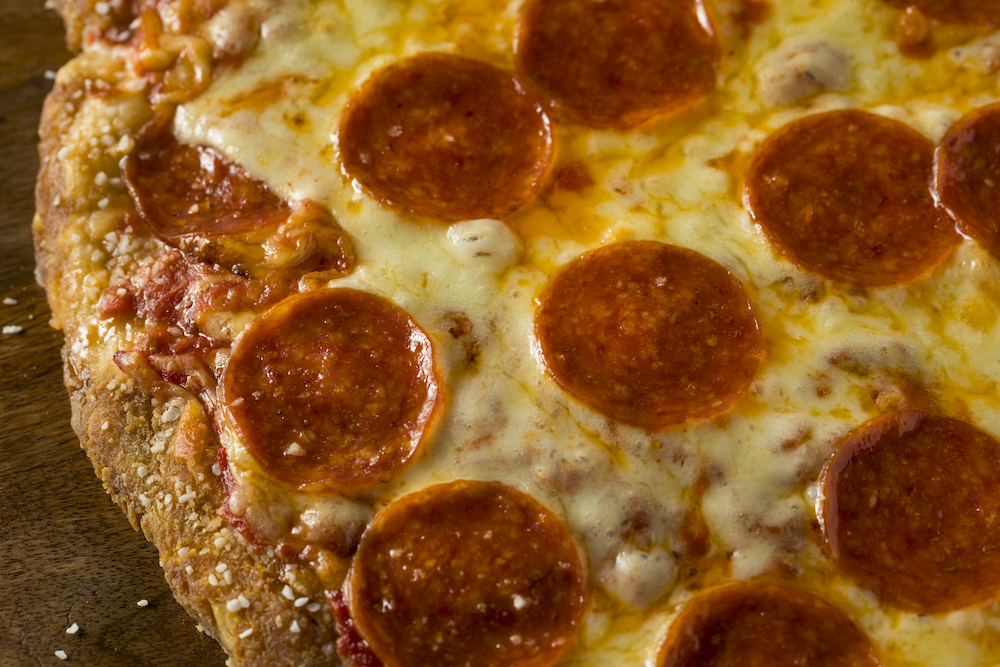 This photo shows a Homemade Pepperoni Pretzel Crust PIzza with Salt and Cheese.