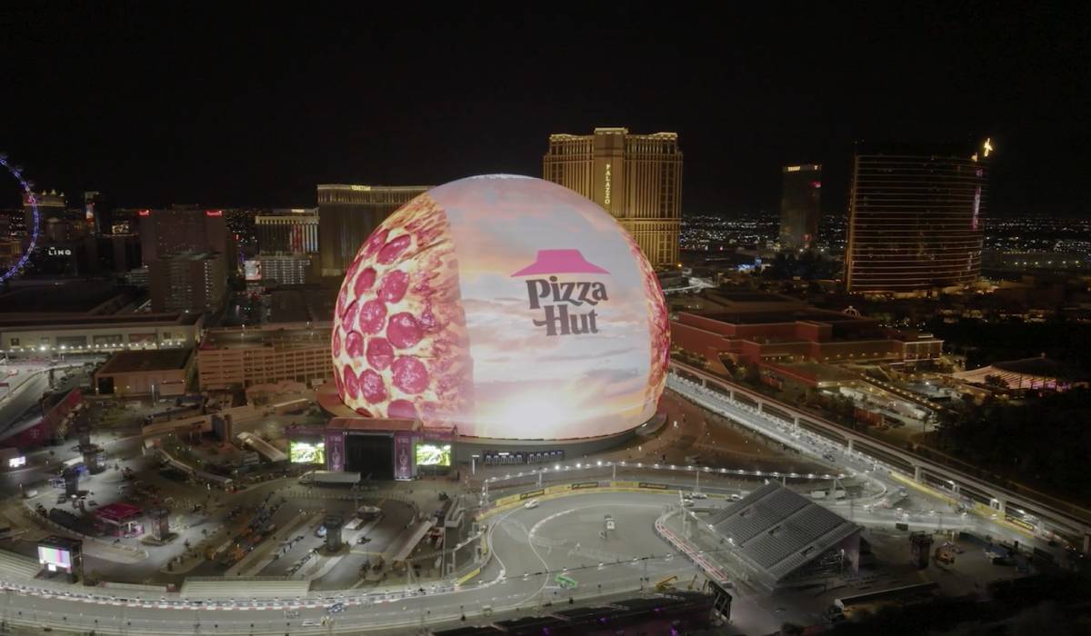 The new $2.3 billion dome was lit up with Pizza Hut on Tuesday.