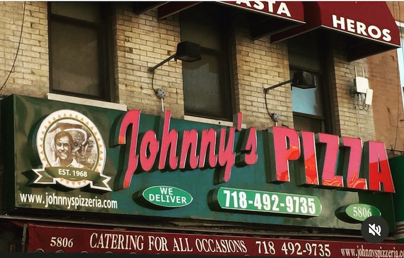 This photo shows the exterior sign of Johnny's Pizzeria.