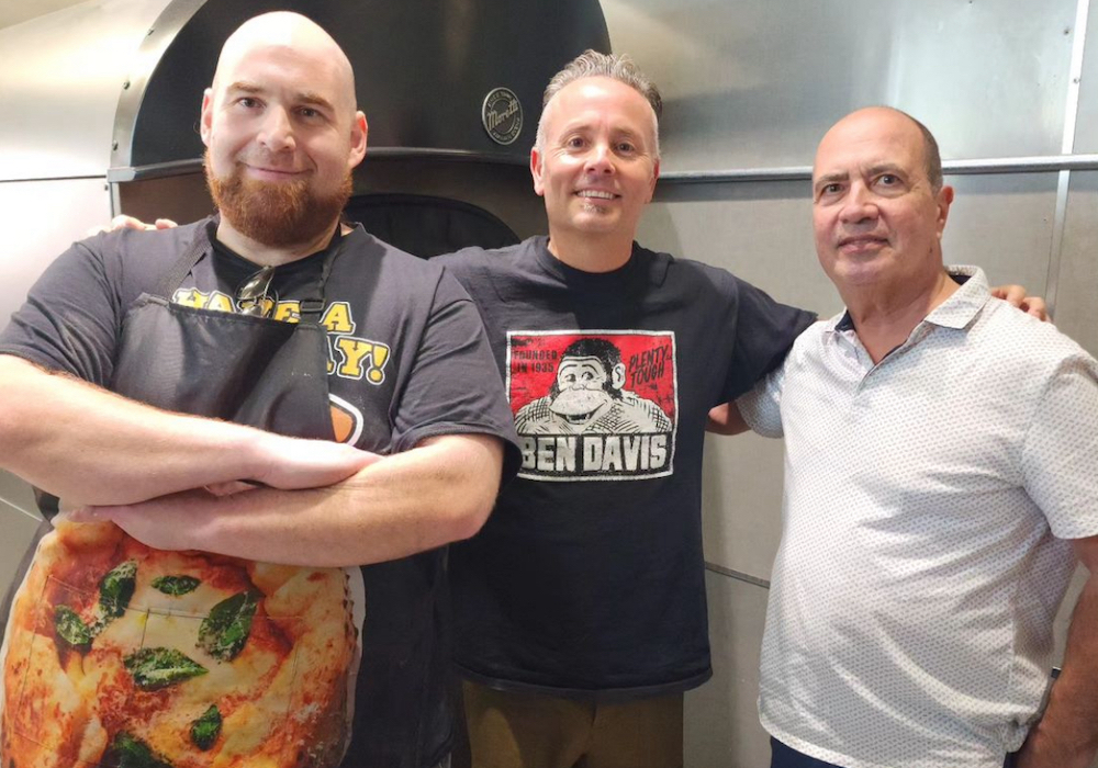 This photo shows Ethan Spiezer with famous pizza chefs Tony Gemignani and John Arena