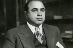 This is a vintage photo of Al Capone in a three-piece suit.