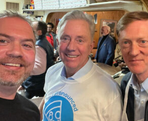 This photo shows Colin Caplan, Connecticut Governor Ned Lamont and New Haven Mayor Justin Elicker at Ernie's Pizzeria.