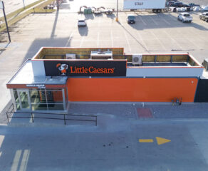 An overhead drone shot of a new Little Caesars prototype, featuring a drive thru.