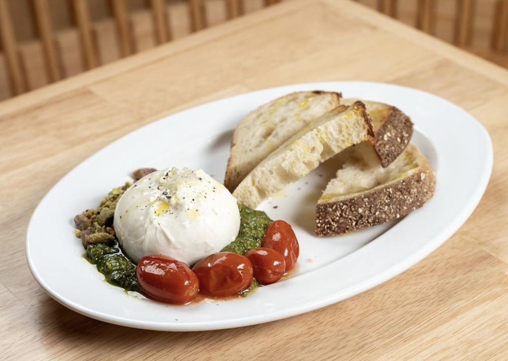 A burrata appetizer with bread.