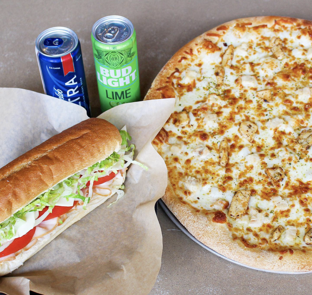 A sub, two cans of beer and a cheese pizza from Planet Pizza in Virginia Beach, VA.