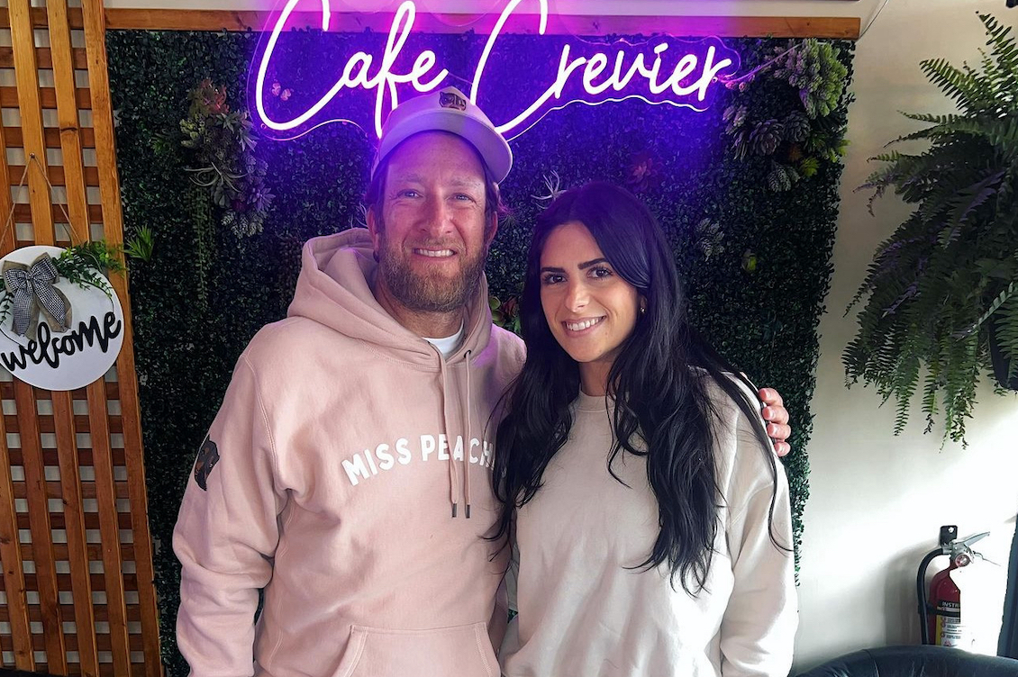 This photo shows Dave Portnoy with an arm around Brittany Crevier as they pose in front of Cafe Crevier.