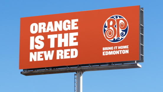 A billboard that says "Orange is the New Read" with Boston Pizza's logo on the other side.