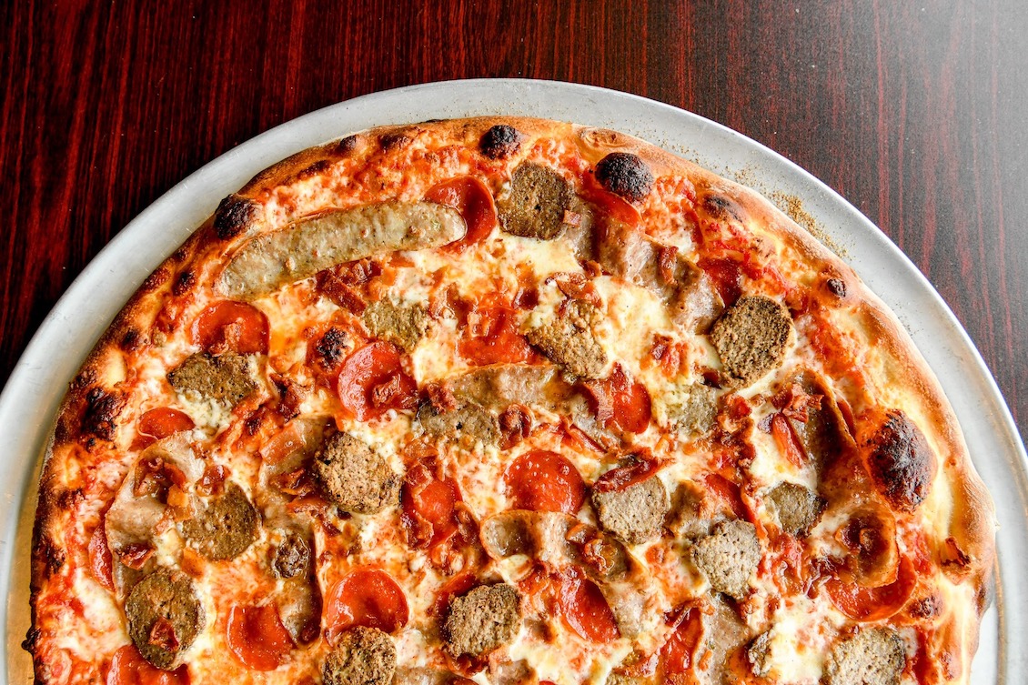 This photo shows a pizza topped with pepperoni and Italian sausage from Cucina LaRosa's.