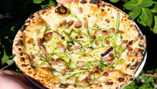 This photo shows a white sauce pizza from Ken's Artisan Pizza.