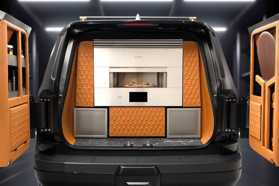 This photo shows the rear of a Lexus outfitted with a pizza oven.