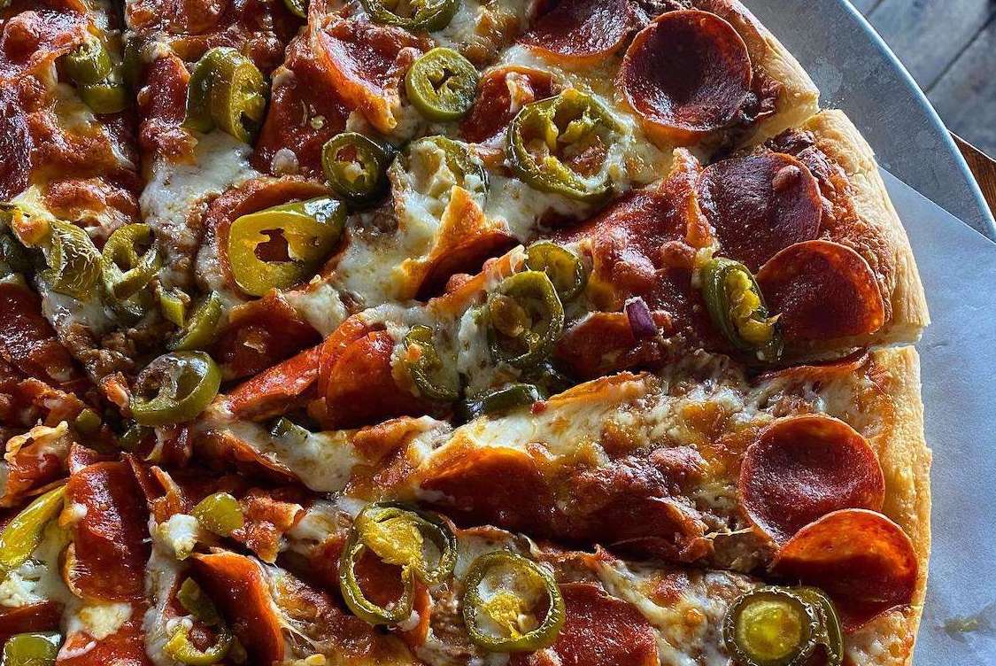 This photo shows the Lowden Zpecial pizza featuring pepperoni, jalapeños, cheese and a peanut butter base.