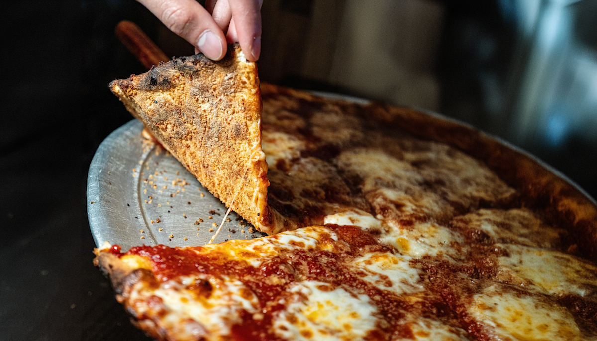 the undercarraige of a New York style pizza made with panko breadcrumbs.