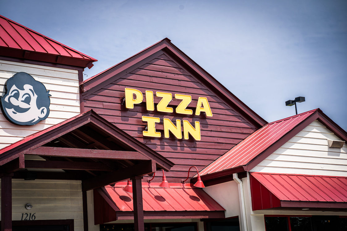 This photo shows the exterior of a Pizza Inn restaurant.