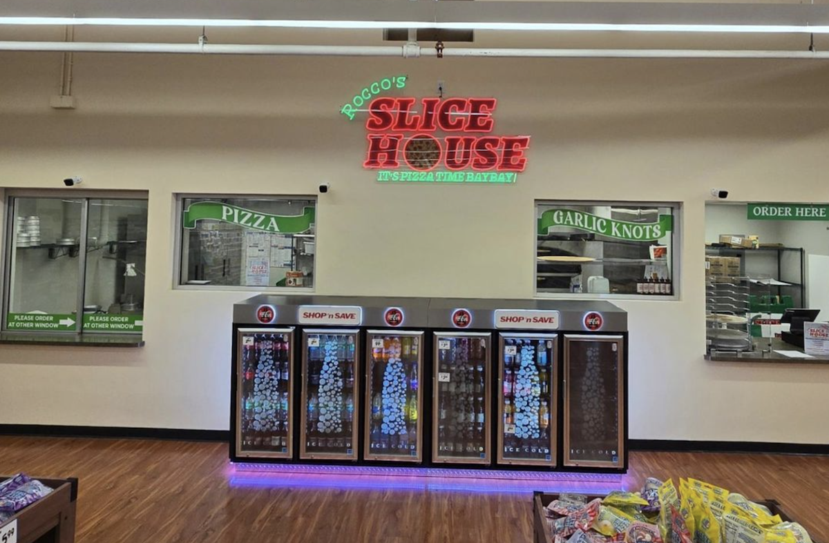 A pizzeria inside of a grocery store.