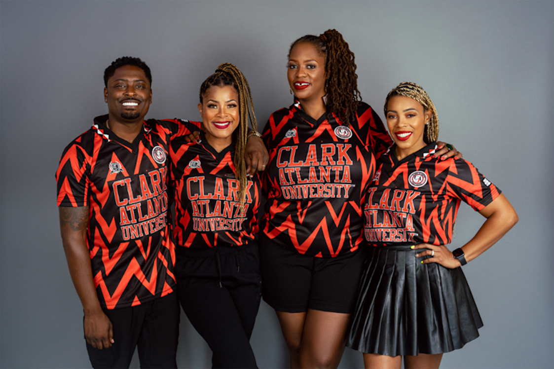 This photo shows the four members of the CAU Collective, clad in matching Clark Atlanta University branded clothing.