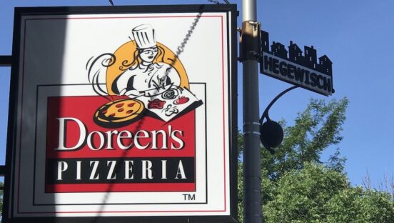 This photo shows the exterior signage at Doreen's Pizzeria.