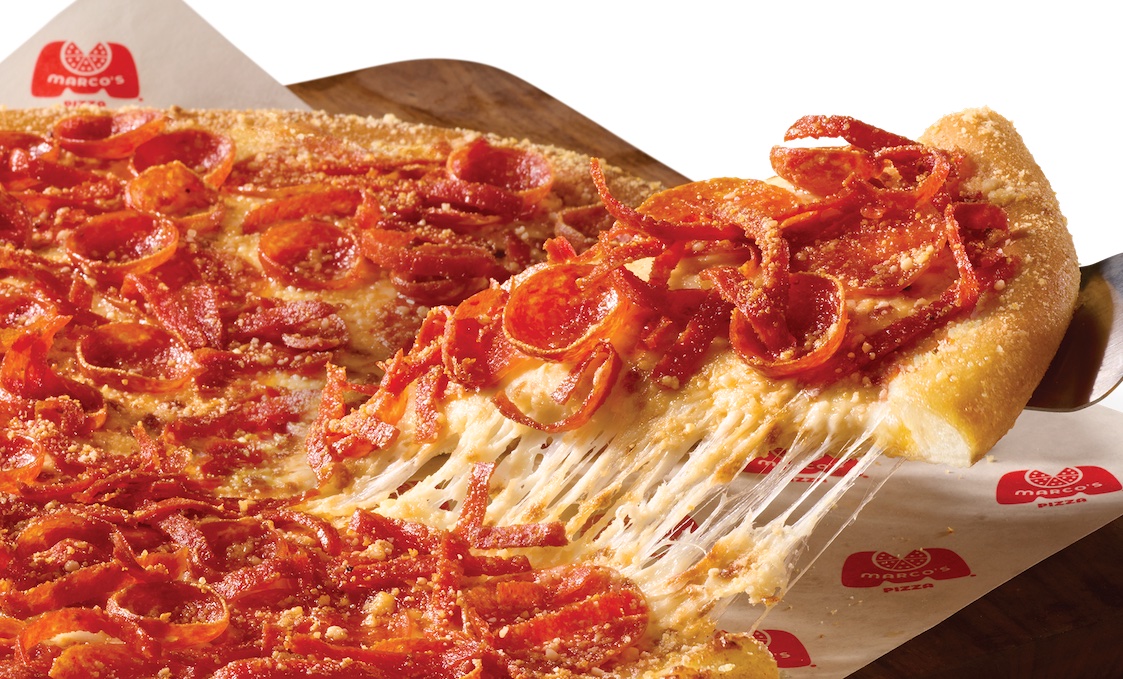 This photo shows a slice of pepperoni pizza being removed from a whole pie.