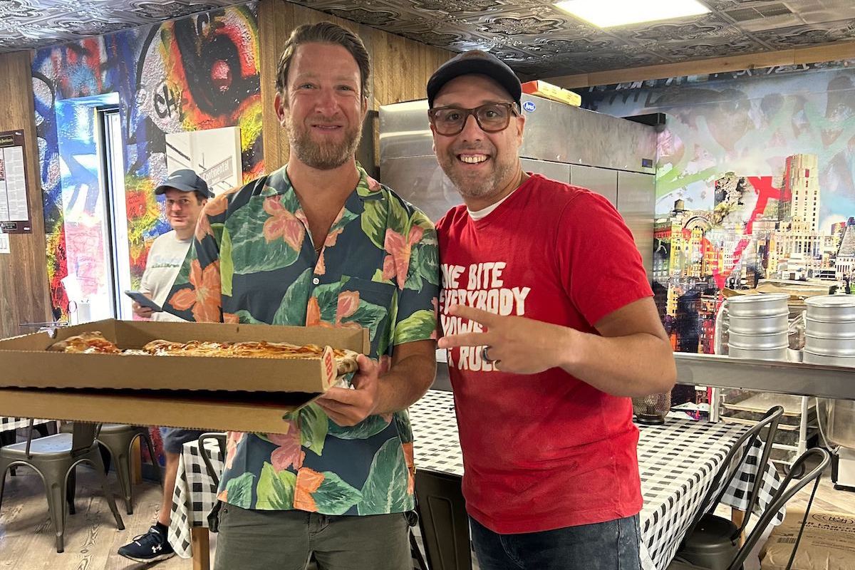 Dave Portnoy poses with Sean Jefairjian of A Slice of New York Pizza in Murrysville, Pennsylvania. Portnoy gave the pizzeria an 8.2 in one of his famed One Bite Reviews.