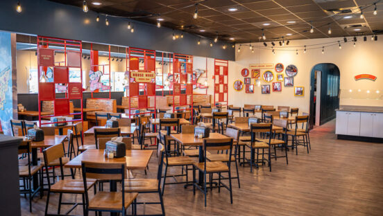 This photo shows the dine-in area of a new Pizza Inn location.