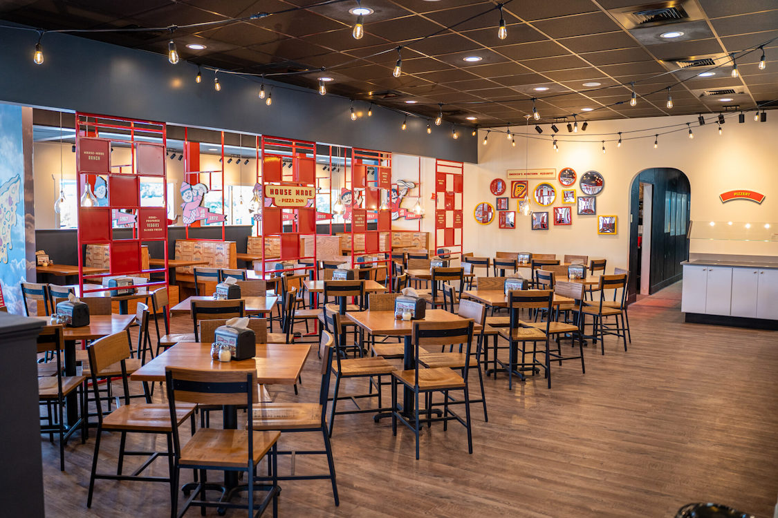 This photo shows the dine-in area of a new Pizza Inn location.