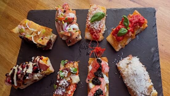 This photo shows some of the miniature pizzas offered in the Pizza Omokase experience at Biga Bite.