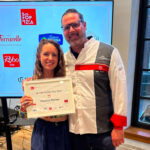 This photo shows Amanda Jones and Jay Langfelder accepting a certificate from 50 Top Pizza.